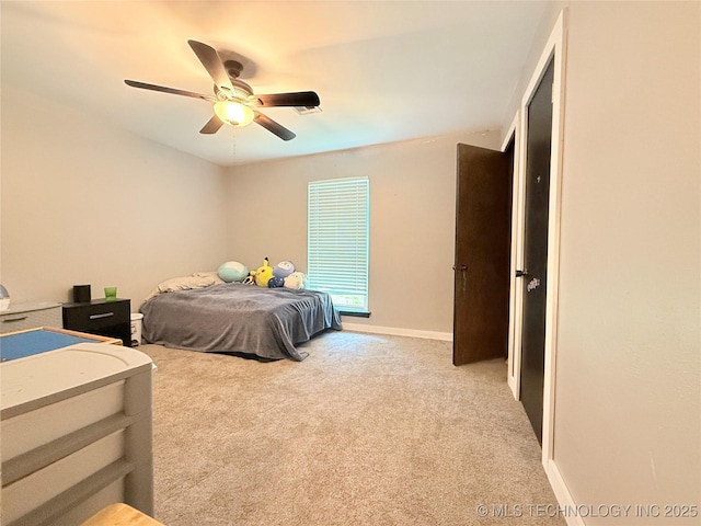 bedroom with carpet flooring, baseboards, and a ceiling fan