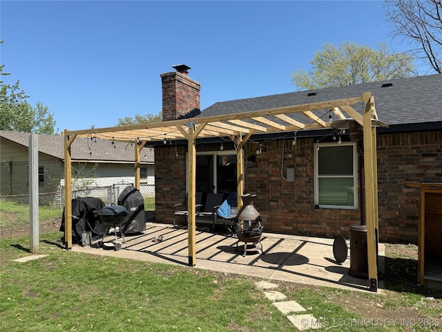 rear view of house with a patio area, a chimney, fence, and a pergola