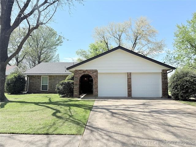 ranch-style house with a garage, a front yard, concrete driveway, and brick siding