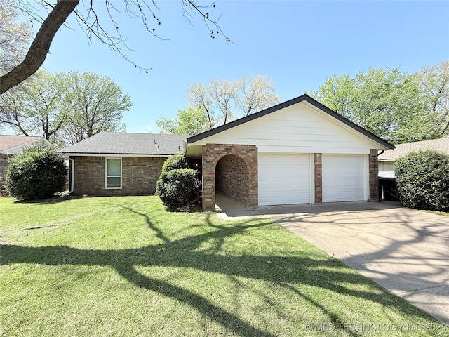 ranch-style house featuring brick siding, a front yard, and a garage