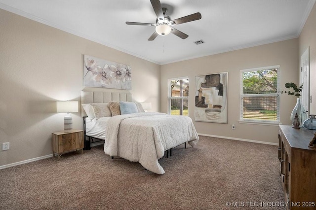 bedroom with baseboards, crown molding, visible vents, ceiling fan, and carpet