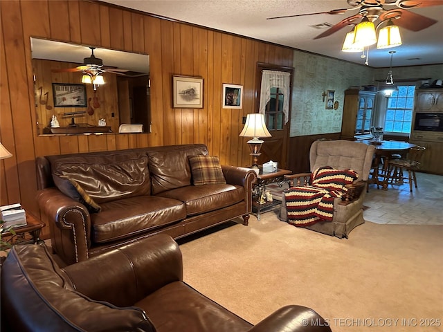 10348 W 805th Rd, Fort Gibson, OK 74434 - carpeted living room with wooden walls, ceiling fan, and visible vents
