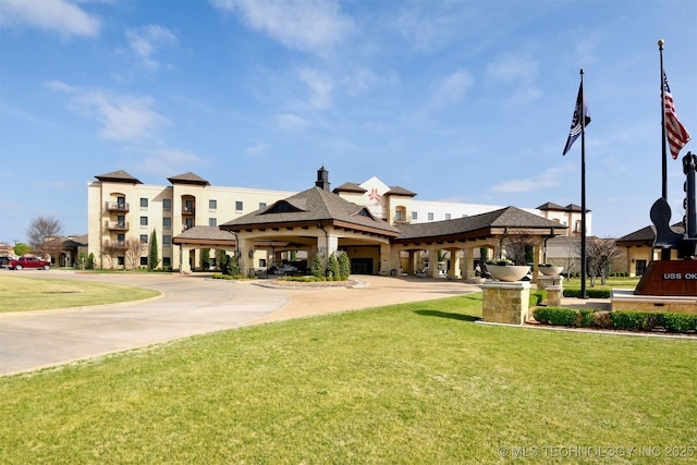 view of property's community with a yard
