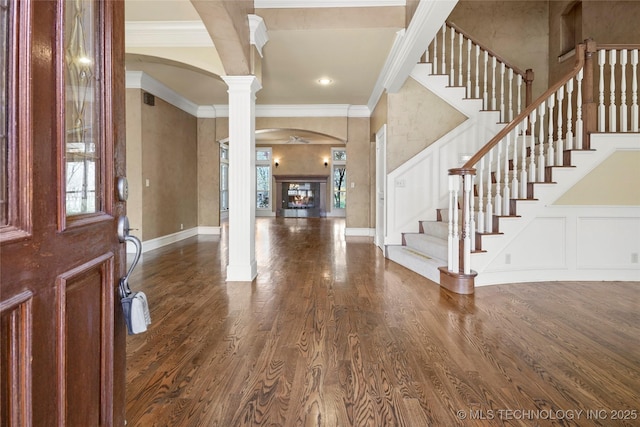 7505 S 4th St, Broken Arrow, OK 74011 - entryway featuring arched walkways, decorative columns, crown molding, healthy amount of natural light, and a decorative wall