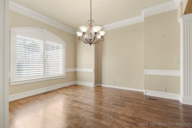7505 S 4th St, Broken Arrow, OK 74011 - spare room with wood finished floors, a chandelier, crown molding, and baseboards
