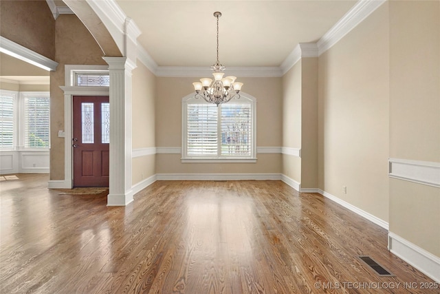 7505 S 4th St, Broken Arrow, OK 74011 - entryway with wood finished floors, a chandelier, arched walkways, crown molding, and baseboards