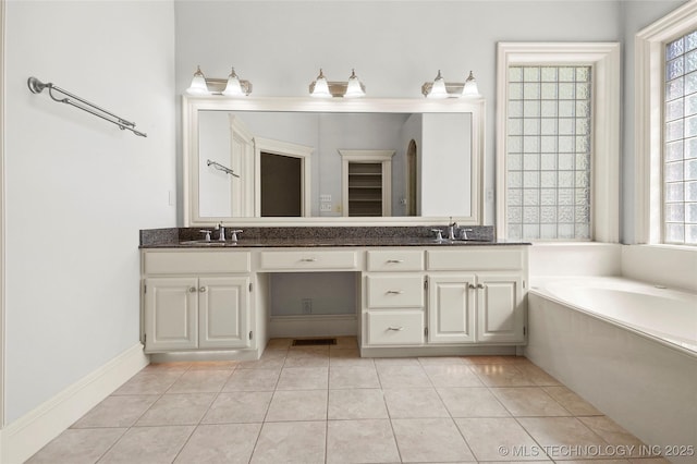 7505 S 4th St, Broken Arrow, OK 74011 - full bathroom with plenty of natural light, double vanity, a bath, and tile patterned floors