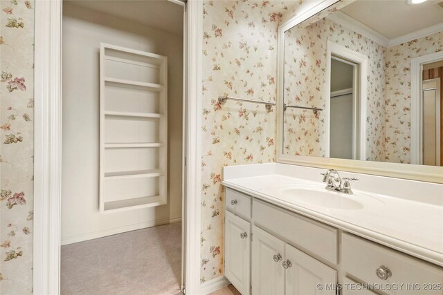 7505 S 4th St, Broken Arrow, OK 74011 - bathroom featuring ornamental molding, vanity, baseboards, and wallpapered walls