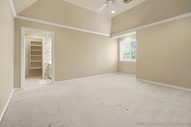7505 S 4th St, Broken Arrow, OK 74011 - empty room featuring a ceiling fan, vaulted ceiling, light colored carpet, and baseboards