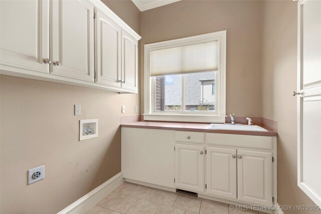 7505 S 4th St, Broken Arrow, OK 74011 - laundry area featuring cabinet space, hookup for a washing machine, baseboards, electric dryer hookup, and light tile patterned floors