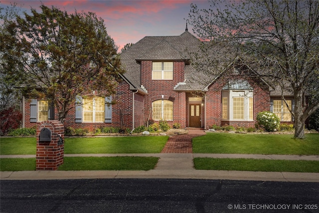 7505 S 4th St, Broken Arrow, OK 74011 - traditional-style home with brick siding, a front yard, and a shingled roof