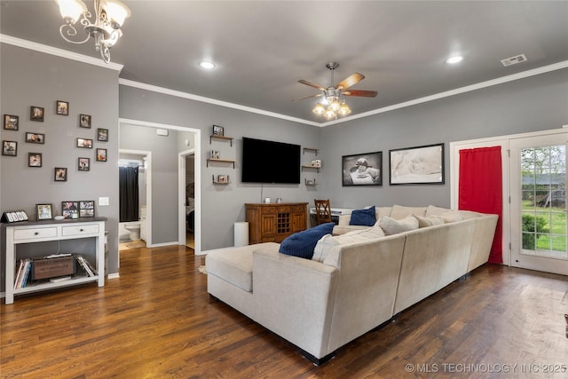 living room featuring dark wood-style flooring, recessed lighting, crown molding, visible vents, and ceiling fan with notable chandelier