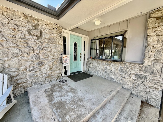 view of exterior entry with stone siding