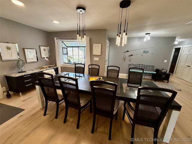 dining room with light wood-type flooring