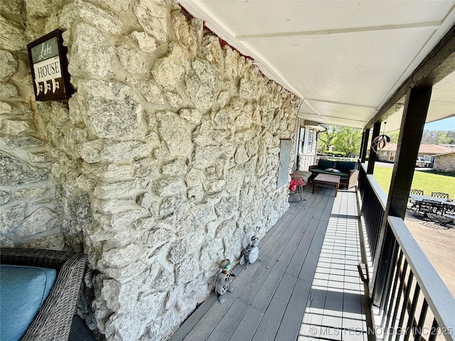wooden deck featuring covered porch
