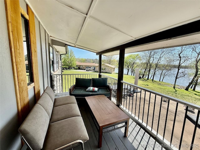 balcony featuring a water view