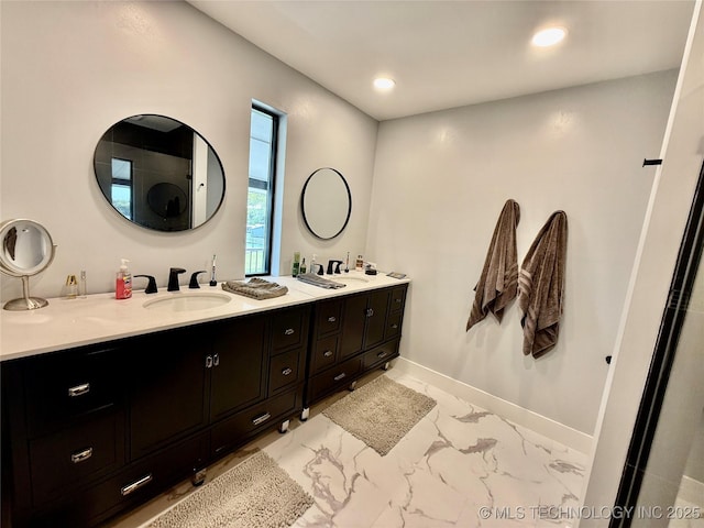 bathroom featuring baseboards, a sink, double vanity, recessed lighting, and marble finish floor