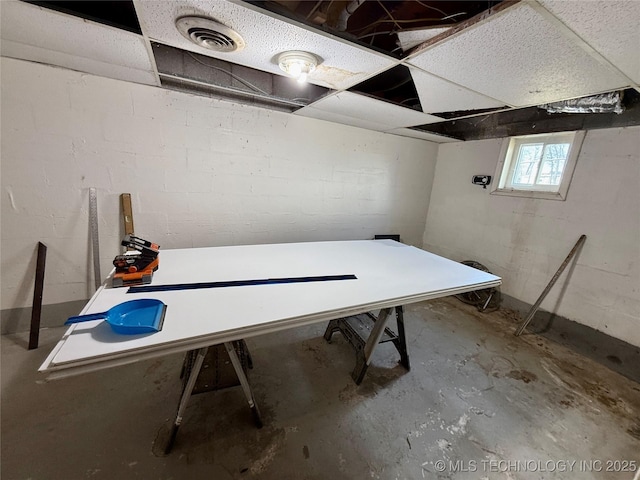 basement with visible vents and concrete block wall