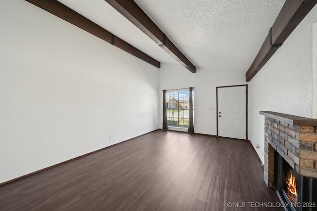 11024 E 15th St, Tulsa, OK 74128 - unfurnished living room with a brick fireplace, dark wood-style flooring, and a textured ceiling
