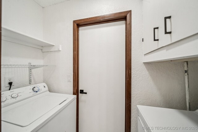 11024 E 15th St, Tulsa, OK 74128 - washroom featuring washer / clothes dryer and cabinet space
