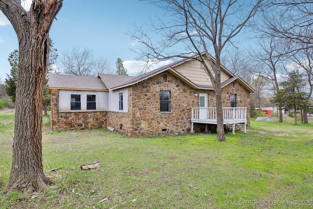 15338 S Brewster Rd, Mounds, OK 74047 - ranch-style house featuring roof with shingles, a front yard, a wooden deck, and stone siding