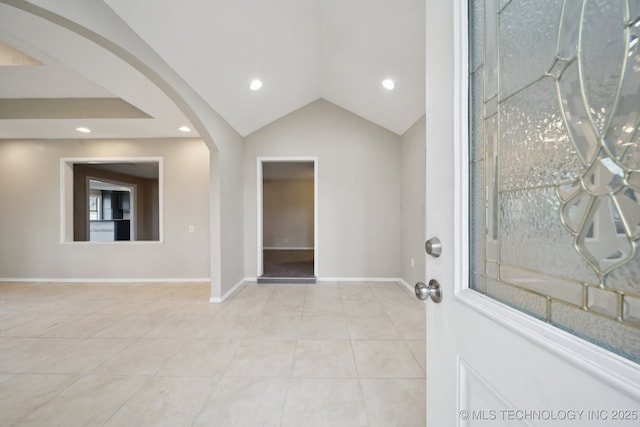 15338 S Brewster Rd, Mounds, OK 74047 - interior space with arched walkways, tile patterned flooring, vaulted ceiling, baseboards, and recessed lighting