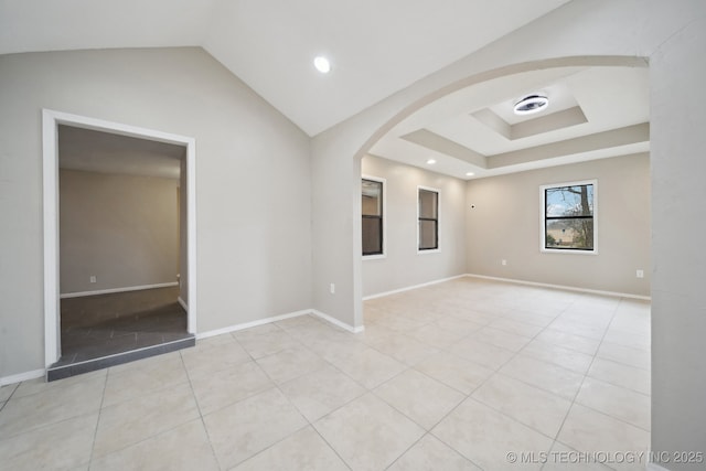 15338 S Brewster Rd, Mounds, OK 74047 - unfurnished room featuring arched walkways, recessed lighting, light tile patterned floors, and lofted ceiling