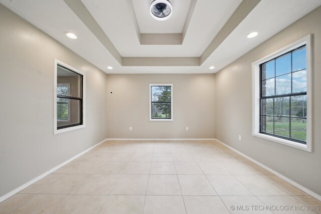 15338 S Brewster Rd, Mounds, OK 74047 - spare room featuring light tile patterned flooring, baseboards, recessed lighting, and a raised ceiling