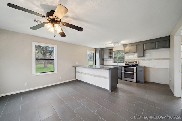 15338 S Brewster Rd, Mounds, OK 74047 - kitchen featuring double oven range, tasteful backsplash, open shelves, a sink, and a peninsula