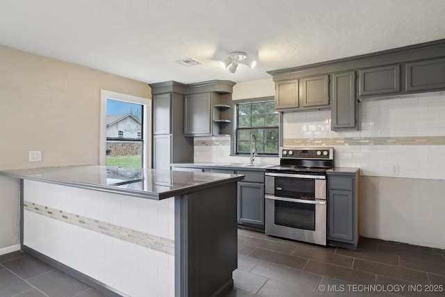 15338 S Brewster Rd, Mounds, OK 74047 - kitchen featuring open shelves, a sink, a peninsula, double oven range, and tasteful backsplash
