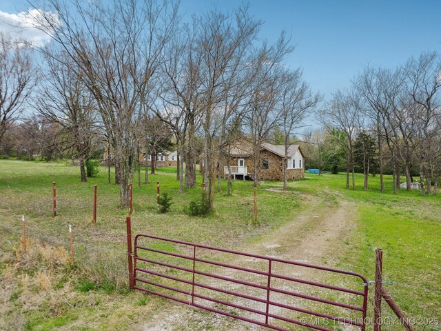 15338 S Brewster Rd, Mounds, OK 74047 - exterior space featuring fence and a yard