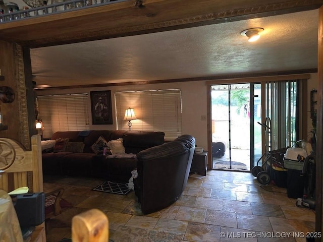 6750 Meridian Rd, Ardmore, OK 73401 - living room featuring stone tile flooring and a textured ceiling