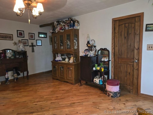 6750 Meridian Rd, Ardmore, OK 73401 - dining space featuring wood finished floors and a chandelier