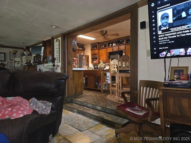 6750 Meridian Rd, Ardmore, OK 73401 - living area with a ceiling fan and stone finish flooring