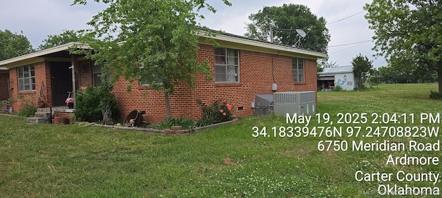 6750 Meridian Rd, Ardmore, OK 73401 - view of property exterior with brick siding, a yard, central AC unit, and crawl space