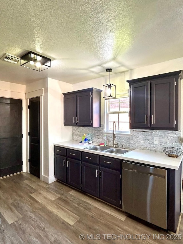 1110 S Catalina Dr, Oologah, OK 74053 - kitchen featuring light countertops, visible vents, dishwasher, a sink, and wood finished floors