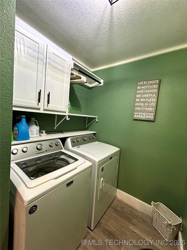 1110 S Catalina Dr, Oologah, OK 74053 - laundry room featuring a textured ceiling, dark wood-style flooring, washer and dryer, baseboards, and cabinet space