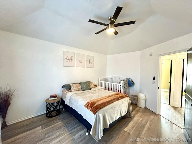 1110 S Catalina Dr, Oologah, OK 74053 - bedroom with ceiling fan, baseboards, vaulted ceiling, and wood finished floors
