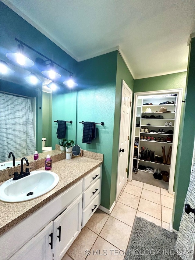 1110 S Catalina Dr, Oologah, OK 74053 - full bathroom with vanity, tile patterned flooring, and a spacious closet