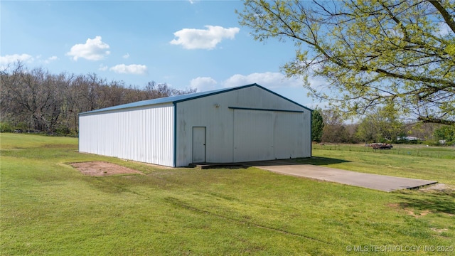 view of pole building with a lawn