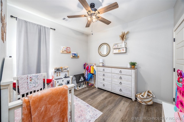 440 W 2nd St, Silo, OK 74701 - bedroom with ceiling fan, visible vents, baseboards, and wood finished floors