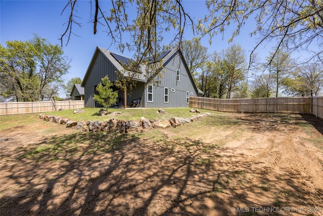 440 W 2nd St, Silo, OK 74701 - exterior space with a fenced backyard, board and batten siding, and a lawn