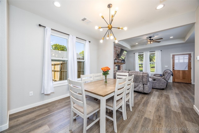 440 W 2nd St, Silo, OK 74701 - dining room featuring a tray ceiling, visible vents, recessed lighting, wood finished floors, and baseboards