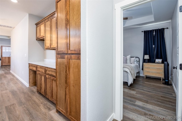 440 W 2nd St, Silo, OK 74701 - hall with visible vents, baseboards, and dark wood-style floors