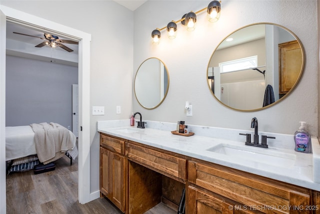 440 W 2nd St, Silo, OK 74701 - ensuite bathroom with wood finished floors, a sink, a ceiling fan, and ensuite bath