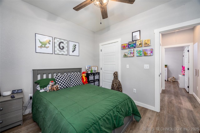 440 W 2nd St, Silo, OK 74701 - bedroom featuring wood finished floors, ceiling fan, and baseboards