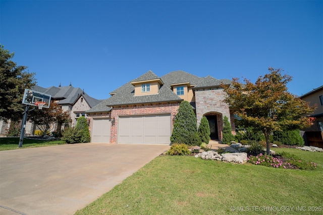 5716 W Austin St, Broken Arrow, OK 74011 - french country home with a garage, a front lawn, concrete driveway, brick siding, and roof with shingles