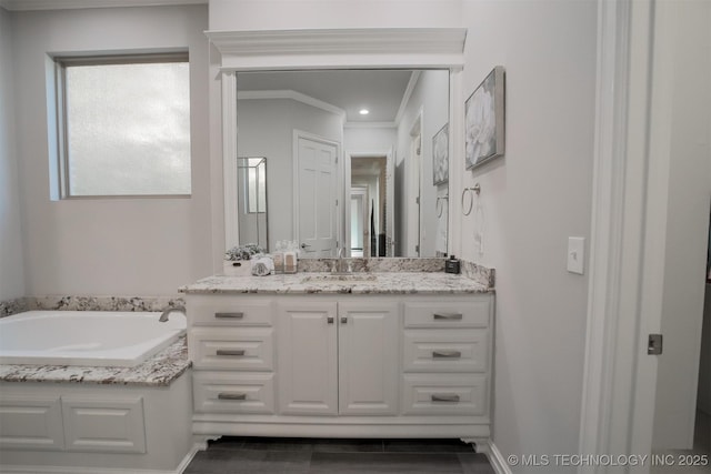 5716 W Austin St, Broken Arrow, OK 74011 - bathroom featuring vanity, a garden tub, and ornamental molding