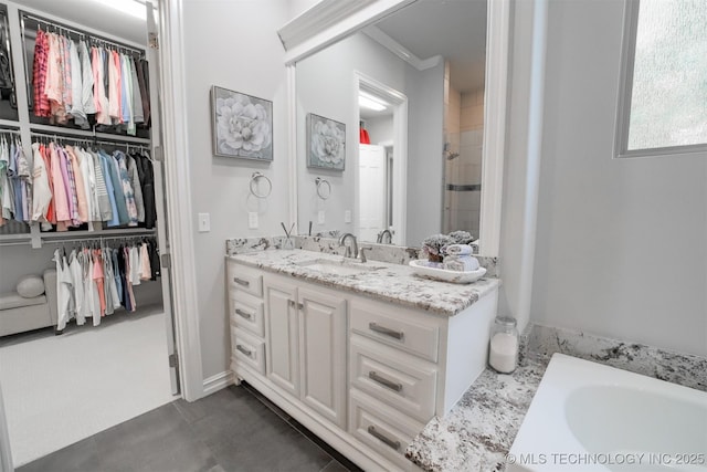 5716 W Austin St, Broken Arrow, OK 74011 - bathroom featuring vanity, a spacious closet, a bath, a tile shower, and ornamental molding
