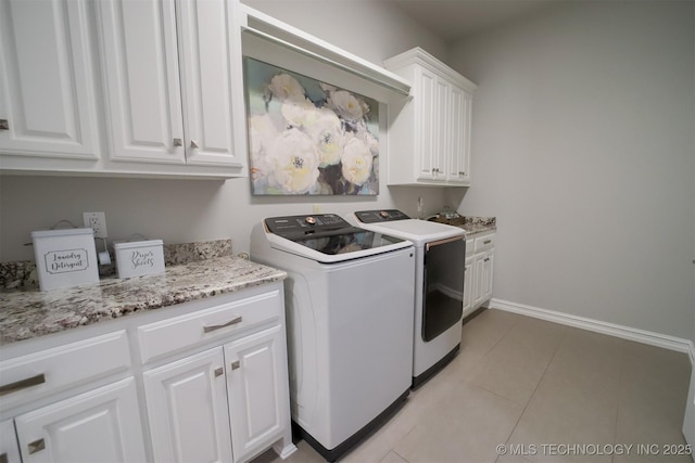 5716 W Austin St, Broken Arrow, OK 74011 - laundry room with cabinet space, separate washer and dryer, and light tile patterned flooring